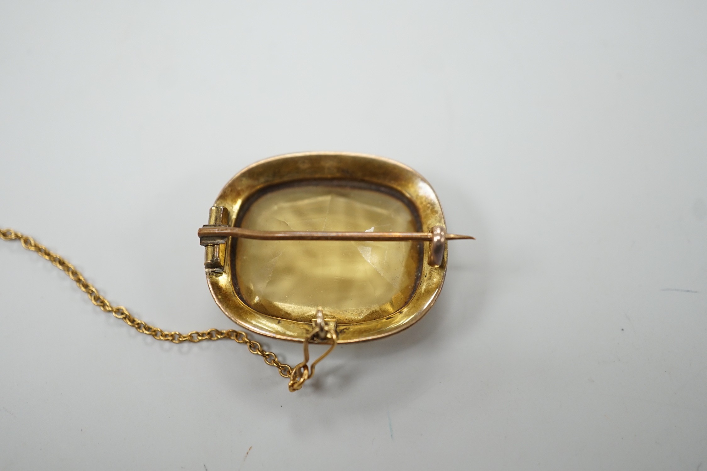 A yellow metal mounted cushion cut citrine set brooch, 27mm, gross weight 6.9 grams.